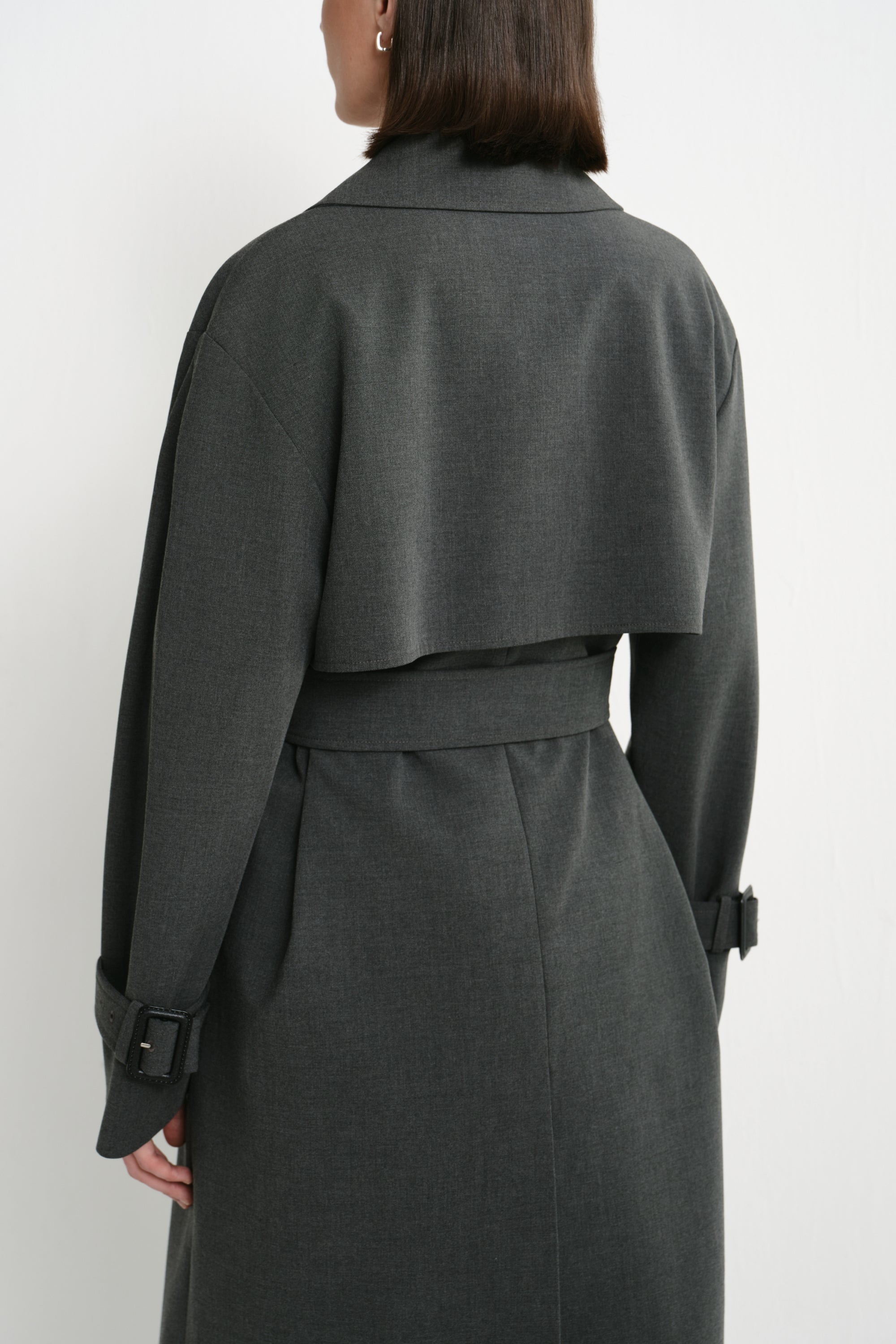 Close-up of the Rue Sophie Gavin Trench Coat in H. Charcoal, highlighting the oversized lapel, double-breasted buttons, shoulder construction, and belted waist detail.