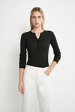 A model wearing the Rue Sophie Richie Button Up Cable Sweater in heather grey with a fitted shape, long sleeves, cable-knit texture, and button-front neckline, front view.