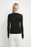 Back view of a model wearing the Rue Sophie Richie Button Up Cable Sweater in heather grey, highlighting the fitted silhouette, long sleeves, and cable-knit texture.